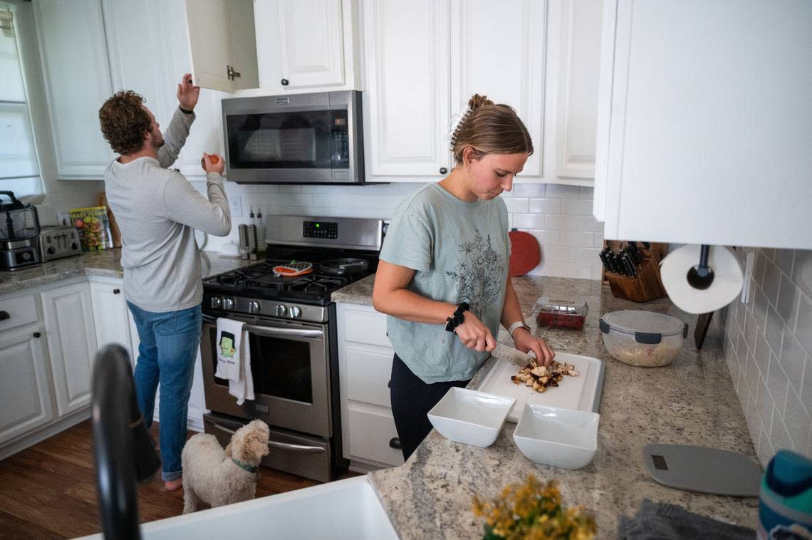 Tanner and Olivia Keller prepare lunch at their home in Lincoln earlier this month.