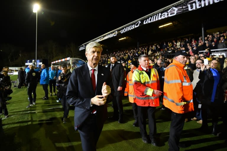 Arsenal's manager Arsene Wenger (C) arrives for the English FA Cup fifth round football match between Sutton United and Arsenal at the Borough Sports Ground, Gander Green Lane in south London on February 20, 2017