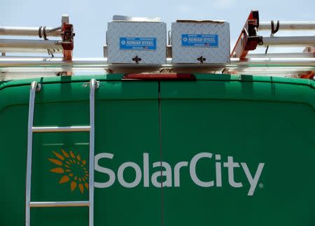 FILE PHOTO: A SolarCity vehicle is seen on the road in San Diego, California, U.S. June 22, 2016. REUTERS/Mike Blake/File Photo