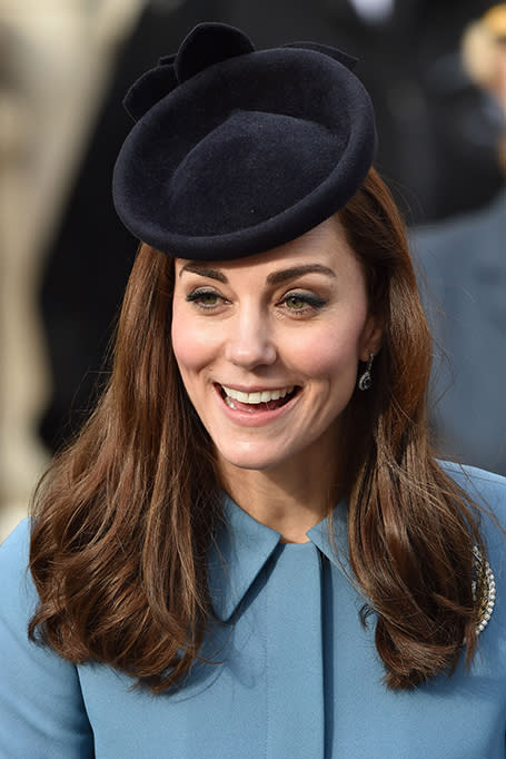<p>An age-old sign of status, Kate’s fascinator is made all the sleeker by her straight shiny hair below.</p>
