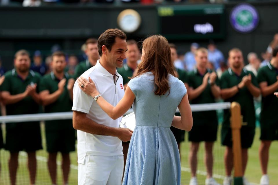 Roger Federer is presented the runners up trophy by the Duchess of Cambridge, 2019 (PA)