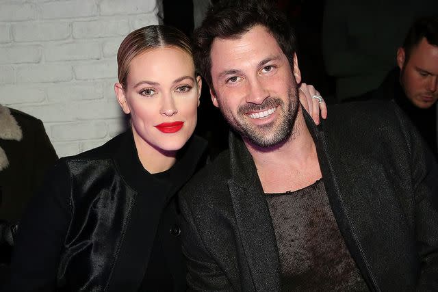 Monica Schipper/Getty Peta Murgatroyd and Maksim Chmerkovskiy attend the VALENTINNICOLE fashion show during New York Fashion Week on Feb. 9, 2017