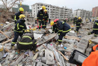 <p>Rescue workers look for survivors after an explosion in Ningbo, China’s eastern Zhejiang province on Nov. 26, 2017. (Photo: STR/AFP/Getty Images) </p>