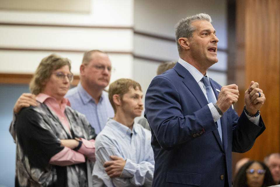 Attorney Eric Bland, right, standing with members of the Satterfield family, addresses the court during Alex Murdaugh's sentencing for stealing from 18 clients, Tuesday, Nov. 28, 2023, at the Beaufort County Courthouse in Beaufort, S.C. (Andrew J. Whitaker/The Post And Courier via AP, Pool)