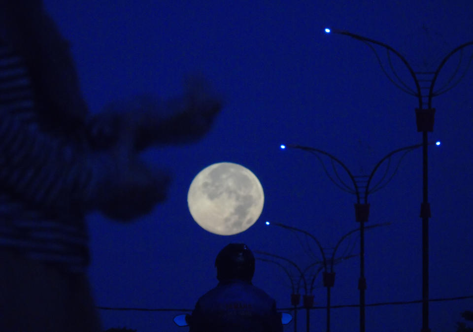 A view of Perigee Supermoon seen in Bintan island, Indonesia on April 8, 2020. The biggest full moon super pink moon perigee can be watched in Indonesian sky. The pink supermoon, sometimes called the Easter full moon, fills the night sky with a bright and radiant spring. (Photo credit Yuli Seperi / Sijori Images/Barcroft Media via Getty Images)