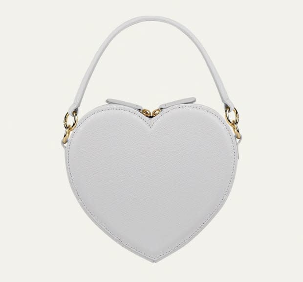 <p>Liselle Kiss Harley Heart Leather Top-Handle Bag, $495, <a href="https://rstyle.me/+-X_Zv2E3RJKOk-2xxvccmQ" rel="nofollow noopener" target="_blank" data-ylk="slk:available here;elm:context_link;itc:0;sec:content-canvas" class="link ">available here</a></p>