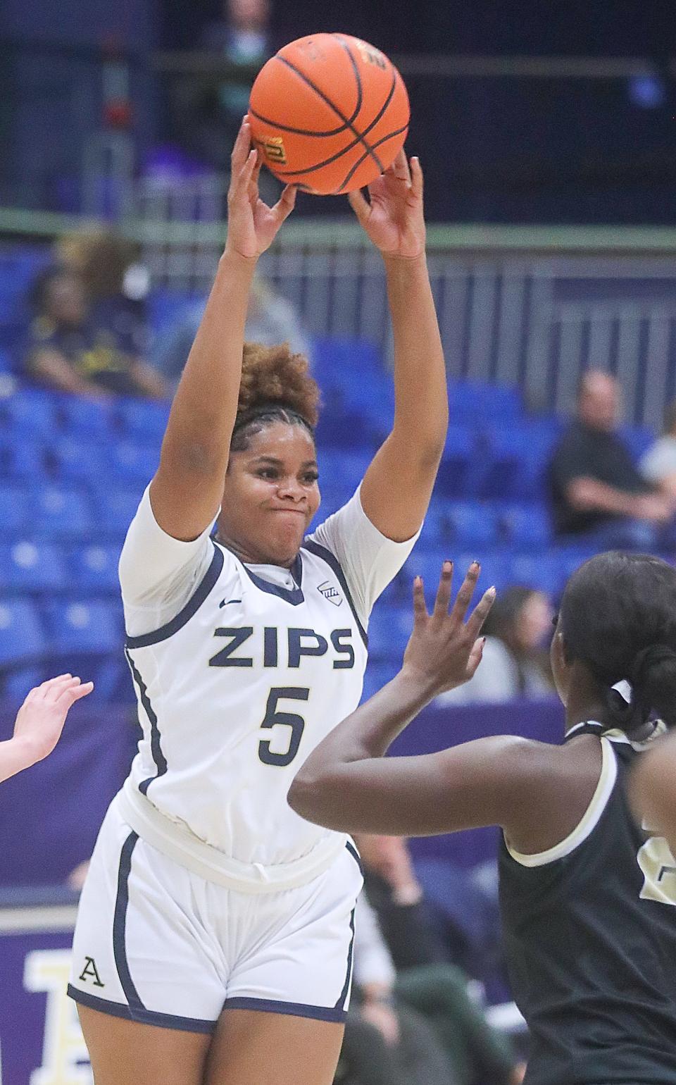 University of Akron forward Lanae Riley looks to pass to a teammate against Oakland on Monday in Akron.