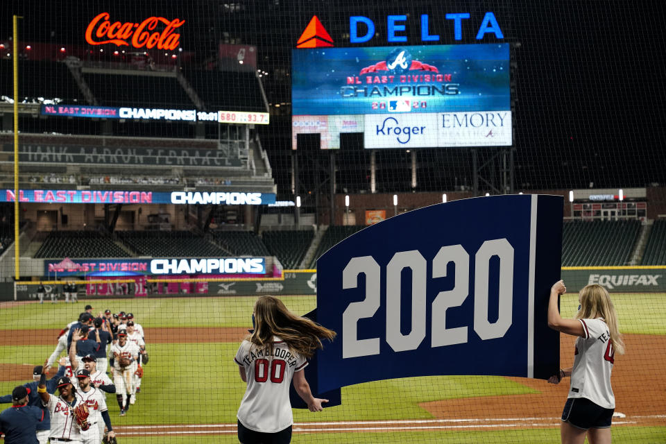 The Atlanta Braves celebrate after a baseball game to clinch the NL East title against the Miami Marlins on Tuesday, Sept. 22, 2020, in Atlanta. (AP Photo/Brynn Anderson)