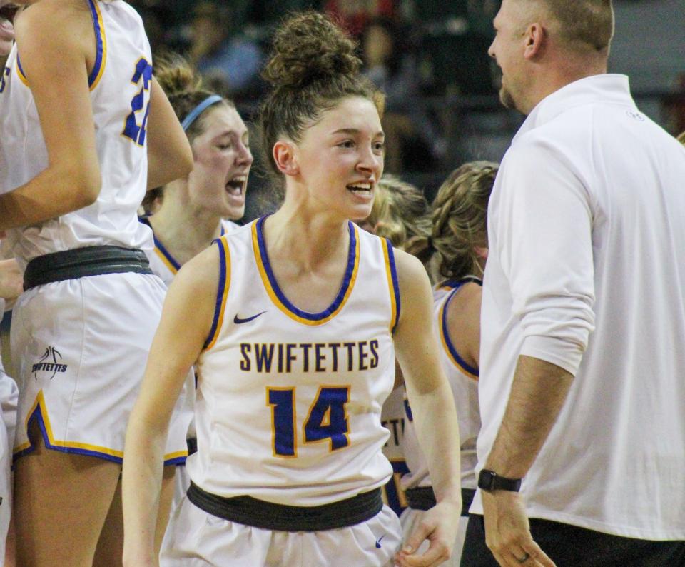 Chloe Birkenfeld celebrates Nazareth's Region I-1A girls basketball championship victory over Claude in the Texan Dome at Levelland on Saturday, Feb. 25, 2023. Birkenfeld had a busy day before and after the game.