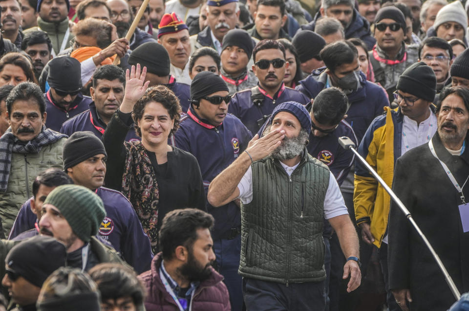 India's opposition Congress party leader Rahul Gandhi, center right and his sister and party leader Priyanka Vadra, center left, gesture toward the crowd as they walk with their supporters during a 5-month-long "Unite India March," in Srinagar, Indian controlled Kashmir, Sunday, Jan. 29, 2023. The countrywide trek, that began from the southernmost tip of India, on Sept. 7., is expected to traverse 3,570 kilometers (2,218 miles) and cross 12 states before finishing in Indian-controlled Kashmir. (AP Photo/Mukhtar Khan)