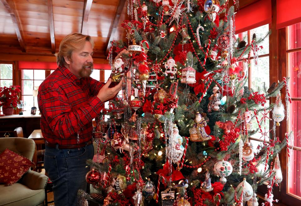 Since 1986, Putnam County resident Christopher Radko has been famous for his Christmas tree ornaments -- designed by him, and created by master glassblowers in Europe. This year he's designing ornaments under a new brand, HeARTfully Yours. Christopher Radko shows a sparkly Santa ornament at home Dec. 12, 2022. 
