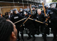 <p>Protesters face off with riot police escorting conservative activists following a march in Boston against a planned ‘Free Speech Rally’ just one week after the violent ‘Unite the Right’ rally in Virginia left one woman dead and dozens more injured on August 19, 2017 in Boston, Mass. (Photo: Spencer Platt/Getty Images) </p>