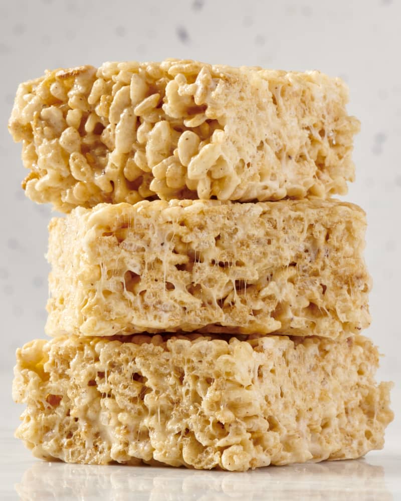 stack of three rice krispy treats on a marble surface