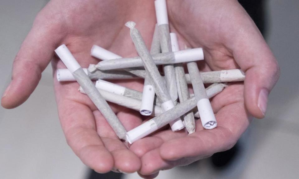 Rocking the joint: an employee holds pre-rolled joints at Buddha Barn Craft Cannabis in Vancouver.