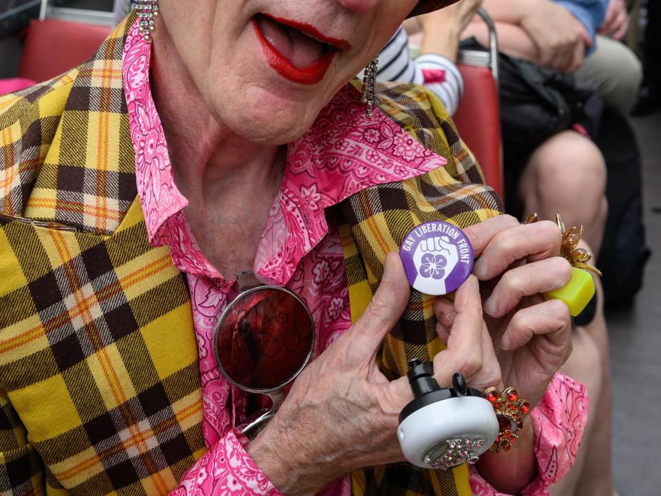 A gay rights activist attaches a new badge (Getty Images)