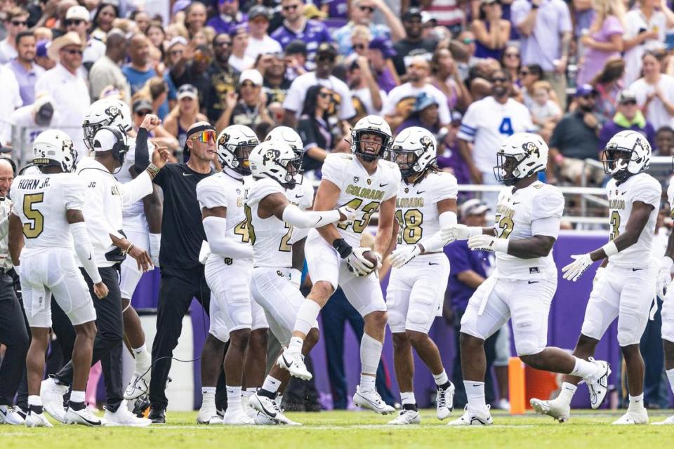 Colorado safety Trevor Woods (43) celebrates with his teammates after intercepting a pass in the end zone in the first quarter of a college football game between the TCU Horned Frogs and the Colorado Buffaloes at Amon G. Carter Stadium in Fort Worth on Saturday, Sept. 2, 2023. Chris Torres/ctorres@star-telegram.com