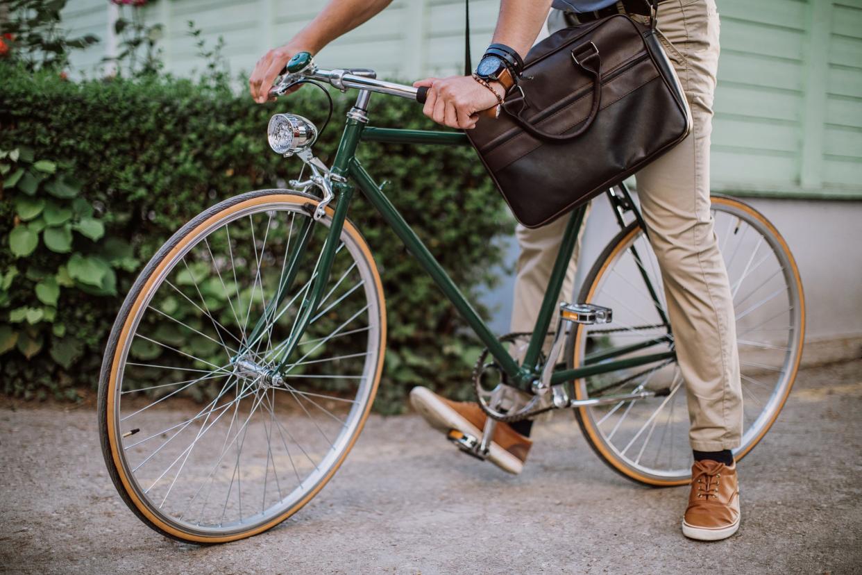 man riding a bike to work