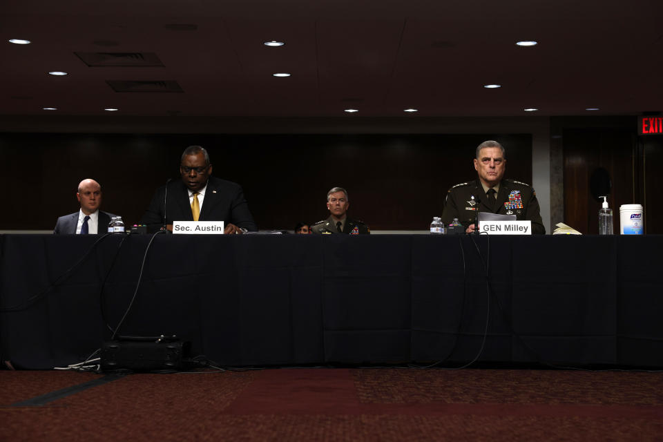 Chairman of the Joint Chiefs of Staff Gen. Mark Milley (R) looks on as U.S. Secretary of Defense Lloyd Austin (L) speaks at a Senate Armed Services Committee hearing on Capitol Hill on June 10, 2021 in Washington, DC.  / Credit: Anna Moneymaker / Getty Images