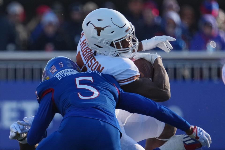 Texas running back Bijan Robinson finished with a career-high 243 rushing yards and four touchdowns against the Jayhawks. He also moved into a fifth-place tie with Chris Gilbert on UT's career rushing list.