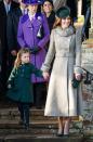 <p>To attend Christmas Day services at Sandringham, Kate paired a chic gray coat with dark green accessories—the latter of which went well with the coat her daughter, Princess Charlotte, was wearing.</p>