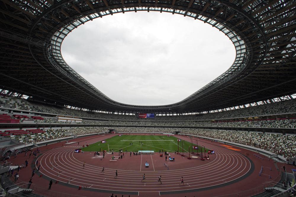 In this May 11, 2021, file photo, athletes compete in the men’s 400-meter T20 race during an athletics test event for the Tokyo 2020 Paralympics Games at National Stadium in Tokyo. (AP Photo/Shuji Kajiyama, File)