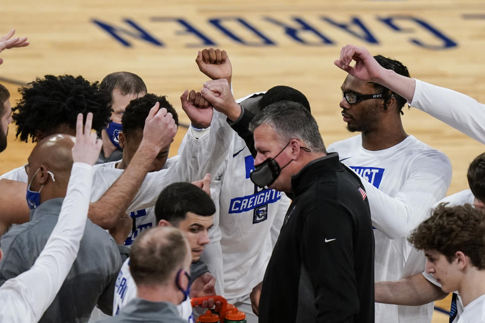 Creighton head coach Greg McDermott talks to his players before an NCAA college basketball game against Butler in the Big East conference tournament Thursday, March 11, 2021, in New York. (AP Photo/Frank Franklin II)