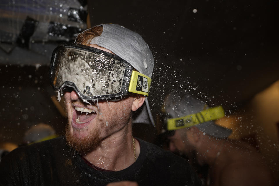 Arizona Diamondbacks outfielder Pavin Smith celebrates in the locker room after their win against the Philadelphia Phillies in Game 7 of the baseball NL Championship Series in Philadelphia Tuesday, Oct. 24, 2023. (AP Photo/Brynn Anderson)