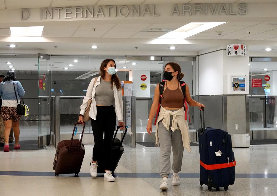 Travelers arrive at Miami International Airport on September 20, 2021.