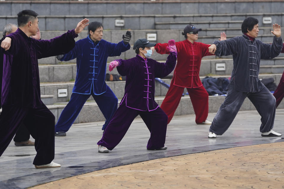 Residents practice tai chi at a park in Wuhan in central China's Hubei Province on Saturday, Jan. 23, 2021. A year after it was locked down to contain the spread of coronavirus, the central Chinese city of Wuhan has largely returned to normal, even as China continues to battle outbreaks elsewhere in the country. (AP Photo/Ng Han Guan)