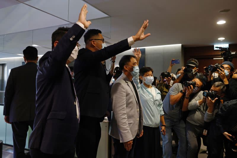 Pro-democracy legislators Helena Wong, Wu Chi-wai, Andrew Wan and Lam Cheuk-ting wave to media after handing in their resignation letters in Hong Kong