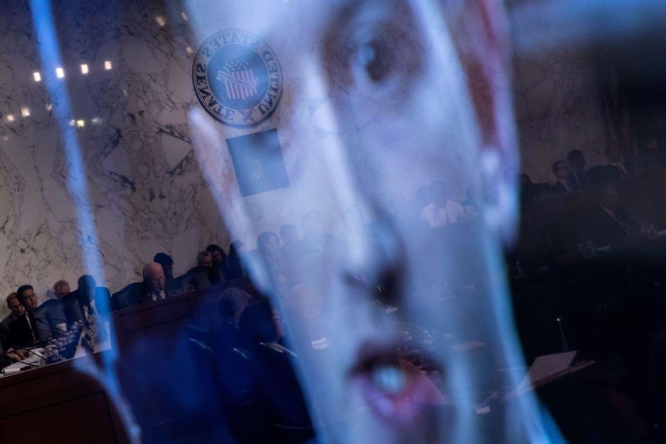 Facebook CEO Mark Zuckerberg is seen on a screen speaking during a joint hearing of the Senate Commerce, Science and Transportation Committee and Senate Judiciary Committee on Capitol Hill April 10, 2018 in Washington, DC: BRENDAN SMIALOWSKI/AFP/Getty Images