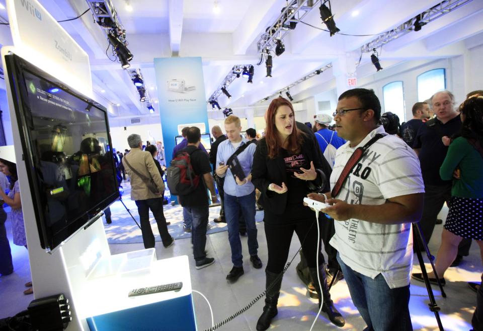 Nintendo's Wii U GamePad and console are unveiled, Thursday, Sept. 13, 2012 in New York. The gaming console will start at $300 and go on sale in the U.S. on Nov. 18, in time for the holidays, the company said Thursday. (AP Photo/Mark Lennihan)