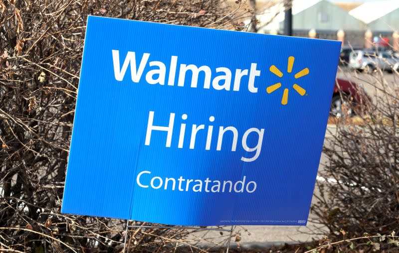 FILE PHOTO: A sign seeking workers is seen at a Walmart store in Westminster