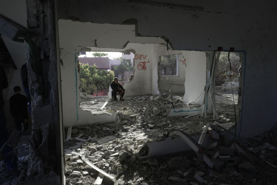 Palestinians check demolished home in the West Bank village of Silat al-Harithiya, near Jenin, Saturday, May 7, 2022. Israeli forces demolished a home of Omar Jaradat who was part of a group who shot and yeshiva student Yehuda Dimentman in the West Bank in December 2021. (AP Photo/Majdi Mohammed)