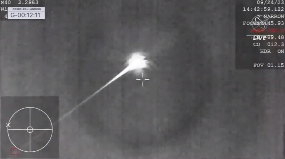 A bright white light is seen streaking through the sky as the capsule enters Earth's atmosphere