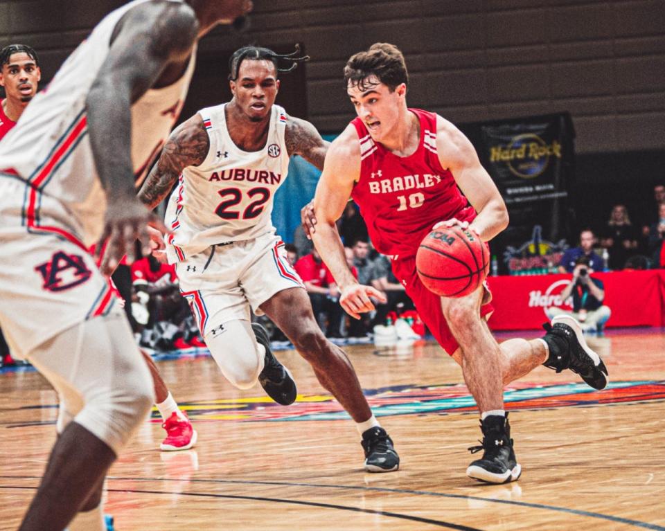 Bradley Braves guard Connor Hickman drives past Auburn's Allen Flanigan during an 85-64 loss in the 2022 Cancun Challenge on Tuesday, Nov. 22, 2022 at Hard Rock Hotel Riviera Maya in Cancun, Mexico.