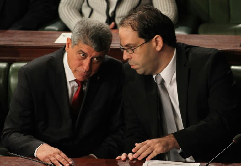 Youssef Chahed (R), pictured with Minister of Justice Ghazi Jribi, will become Tunisia's youngest prime minister since it won independence from France in 1956