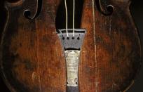 The violin that belonged to Titanic bandmaster Wallace Hartley is seen on display at the Titanic Center in Belfast in this September 18, 2013 file photograph. (REUTERS/Cathal McNaughton)