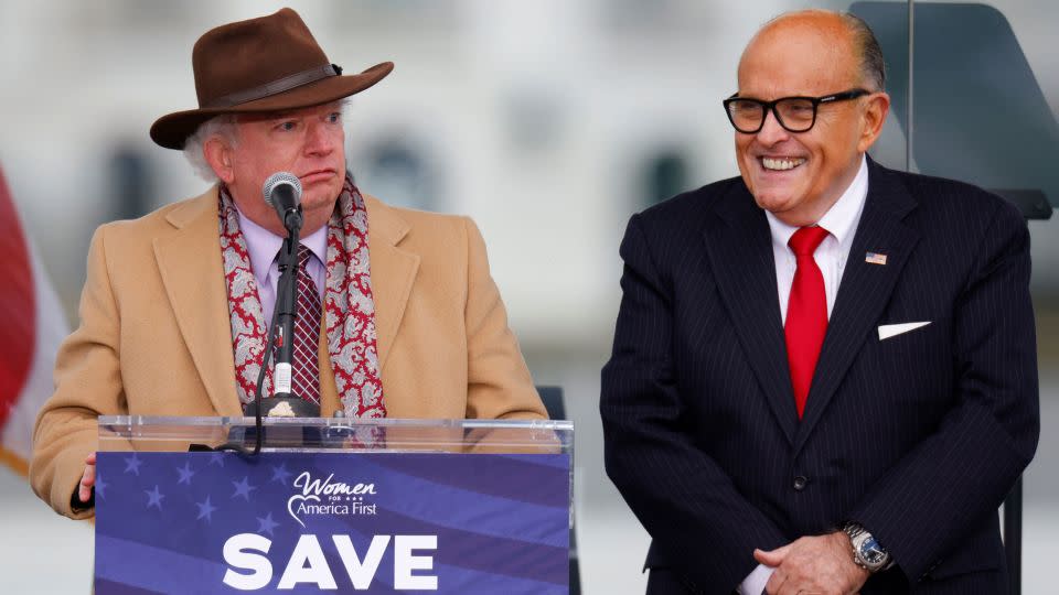 Attorney John Eastman, left, speaks next to Rudy Giuliani, as Trump supporters gather ahead of the president's speech to contest the certification by the US Congress of the results of the 2020 presidential election on the Ellipse on January 6, 2021. - Jim Bourg/Reuters