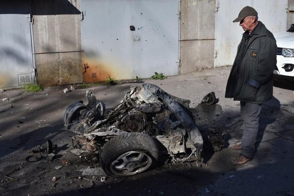 The debris of a car following a Russian missile attack in Zaporizhzhia on Wednesday (AP)