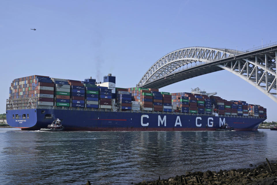 The CMA CGM Marco Polo passes underneath the Bayonne Bridge on its way to the Elizabeth-Port Authority Marine Terminal as seen from Bayonne, N.J., Thursday, May 20, 2021. When the CMA CGM Marco Polo docks in New Jersey Thursday it will set a record for the largest container ship ever to visit the East Coast, a reflection both of the New York/New Jersey port system's multibillion-dollar efforts to accommodate larger ships and of the surging demand nationwide for products as COVID-19 restrictions continue to ease. (AP Photo/Seth Wenig)