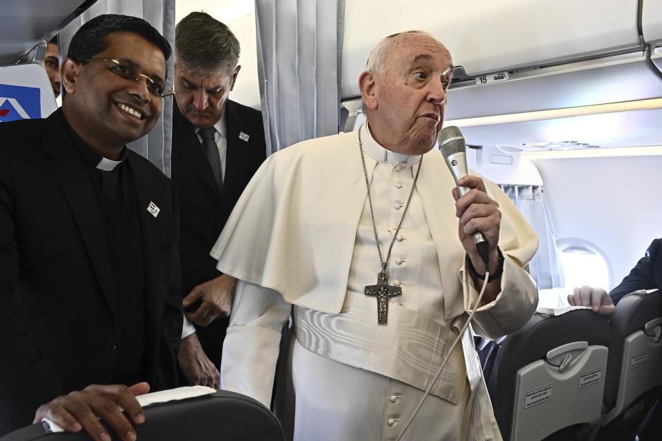Pope Francis meets the journalists aboard of the flight to Budapest, on the occasion of a three-day pastoral visit to Hungary, Friday, April 28, 2023. (Luca Zennaro/Pool ANSA via AP)