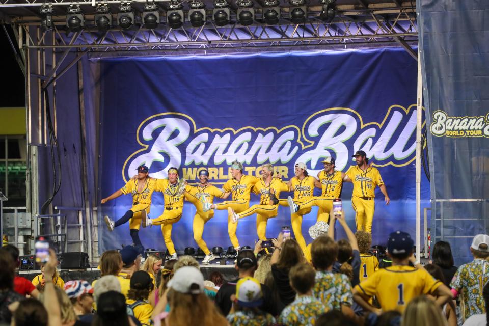 Savannah Banana players play a kickline after announcing The Tea will play at Yankee Stadium in New York during the 2025 Banana Ball World Tour City Draft on Thursday, October 3, 2024 at historic Grayson Stadium.