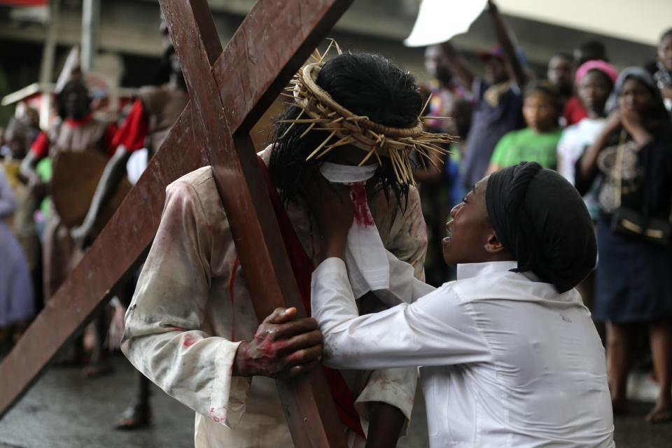 Catholic faithful perform a re-enactment of the death of Jesus Christ, on Good Friday in Lagos