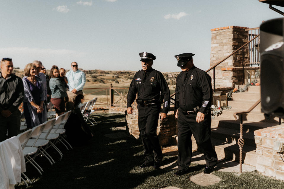 Officers Jeff Barron and Chris Shotts walked behind Ms Young and her mother down the aisle 