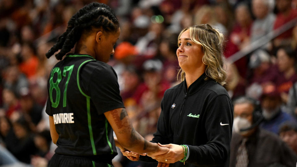 BLACKSBURG, Va. - March 22: Marshall Thundering Herd head coach Kim Caldwell consoles Tamia Lawhorn during an NCAA Tournament game.  (Greg Fiume/NCAA Photo, Getty Images)