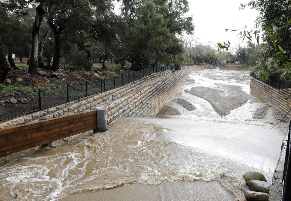 Hot Springs Creek flows into a debris basin after heavy rain in Santa Barbara, Calif., Wednesday, March 6, 2019. A downpour rolled into California with spectacular lightning and thunderclaps Tuesday night in one of the most electric storm systems of the winter. The storm was the latest atmospheric river to flow into California this winter. The National Weather Service reported "copious" lightning strikes as the long plume of Pacific moisture approached the coast on Tuesday. (AP Photo/Daniel Dreifuss)