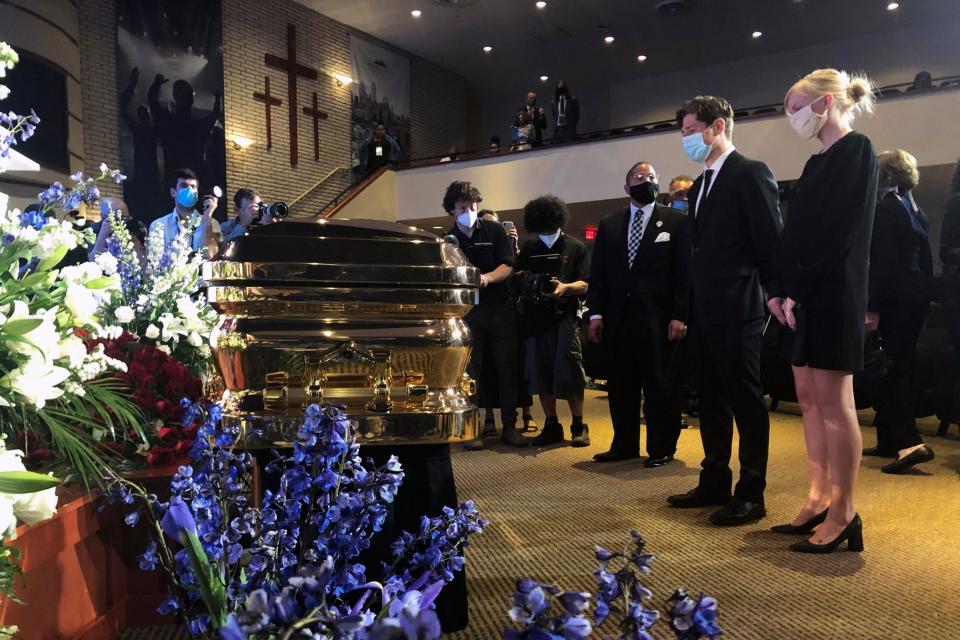Mayor Jacob Frey, second from right, and First Lady Sarah Clarke, pause before George Floyd's casket (AP)