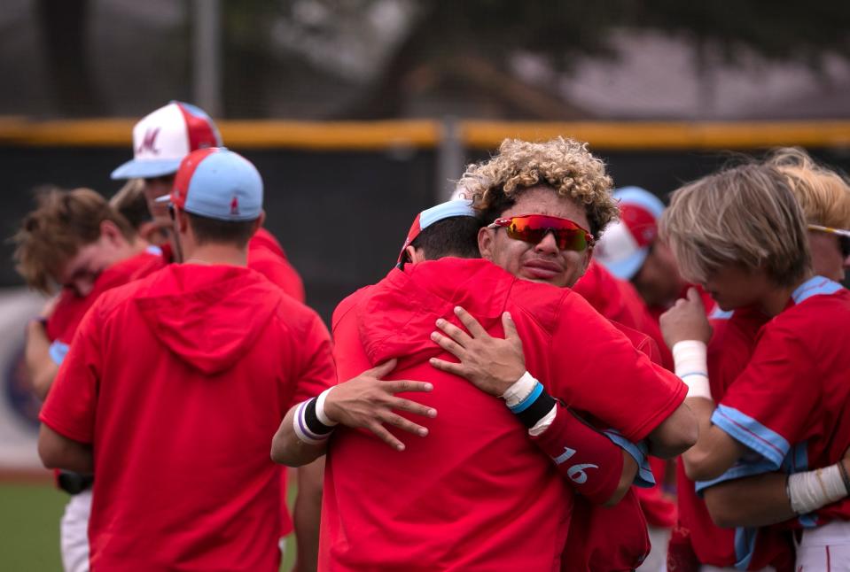 Monterey’s team embraces their loss against Abilene Wylie in game two of the Region I-5A quarterfinal baseball series, Saturday, May 20, 2023, at Erine Johnson Field in Midland 
