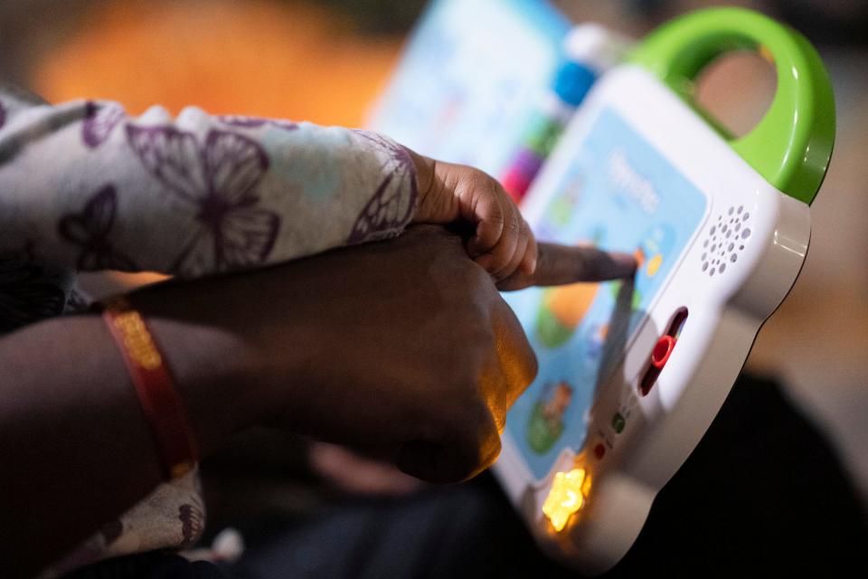 Ernest Levert Jr. plays a children’s game recently with his 16-month-old daughter, Zamya, in their home. Levert said that he wants his daughter to explore the world and to "figure out what she’s attracted to, what she’s pulled to … whether it’s nature or space or martial arts.”